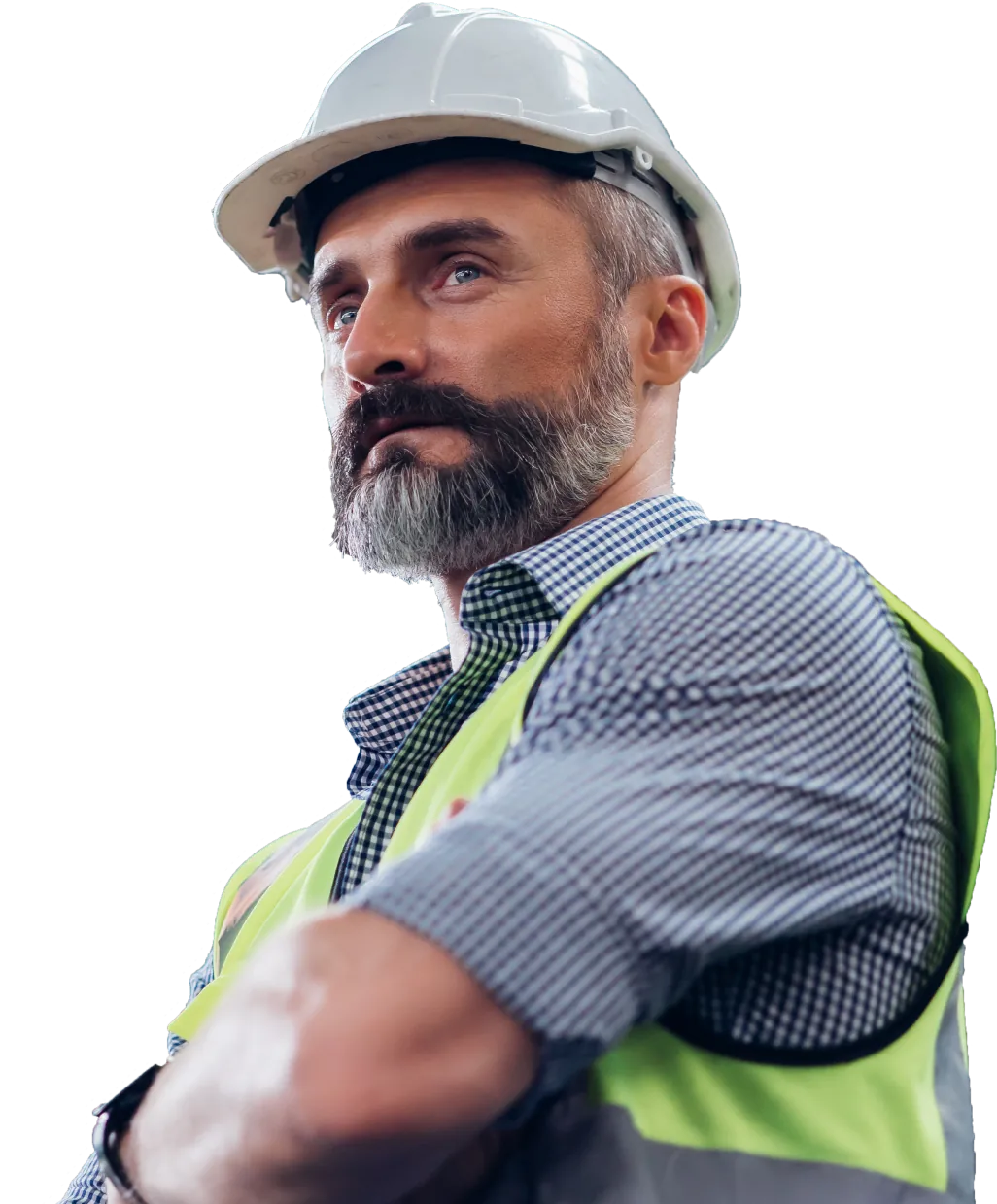 Man in a white hard hat stands with his arms crossed and looks off into the distance.